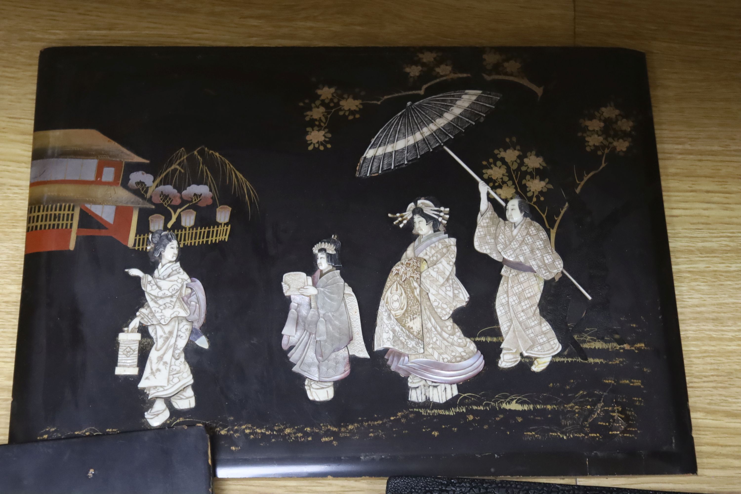 Five 19th century Japanese lacquer and bone panels, largest 45 x 30cm